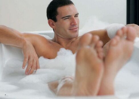 a man takes a bath with soda to enlarge his penis